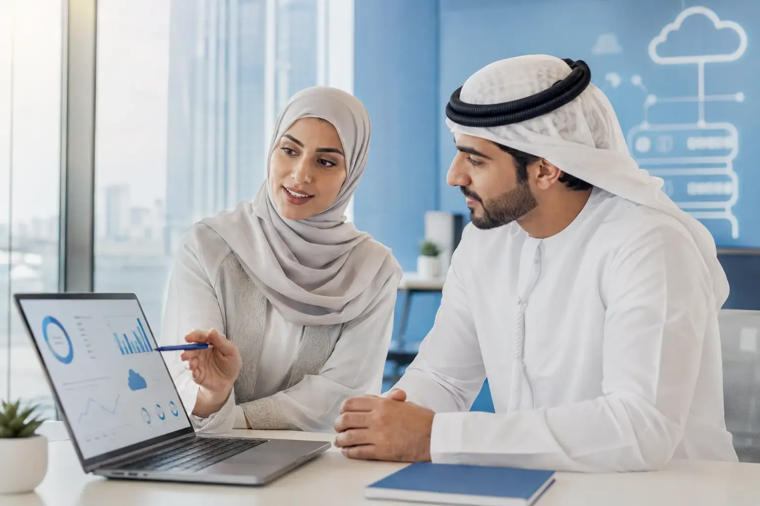 A Gulf cloud advisor reviewing business licensing costs with a client