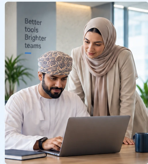 An Omani business professional reviewing a Google Workspace setup plan with a consultant